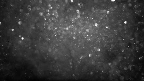 Fondo-De-Partículas-Brillantes-En-Blanco-Y-Negro-Monocromático-Abstracto-Con-Bucle-De-Luces-Bokeh-Brillante