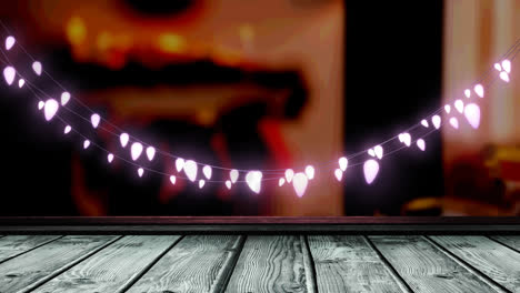 Animation-of-fairy-lights-over-wooden-boards