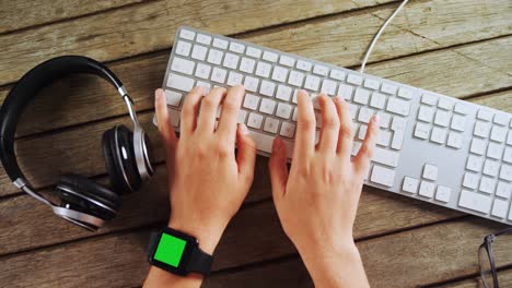 executive typing on keyboard in office at desk 4k