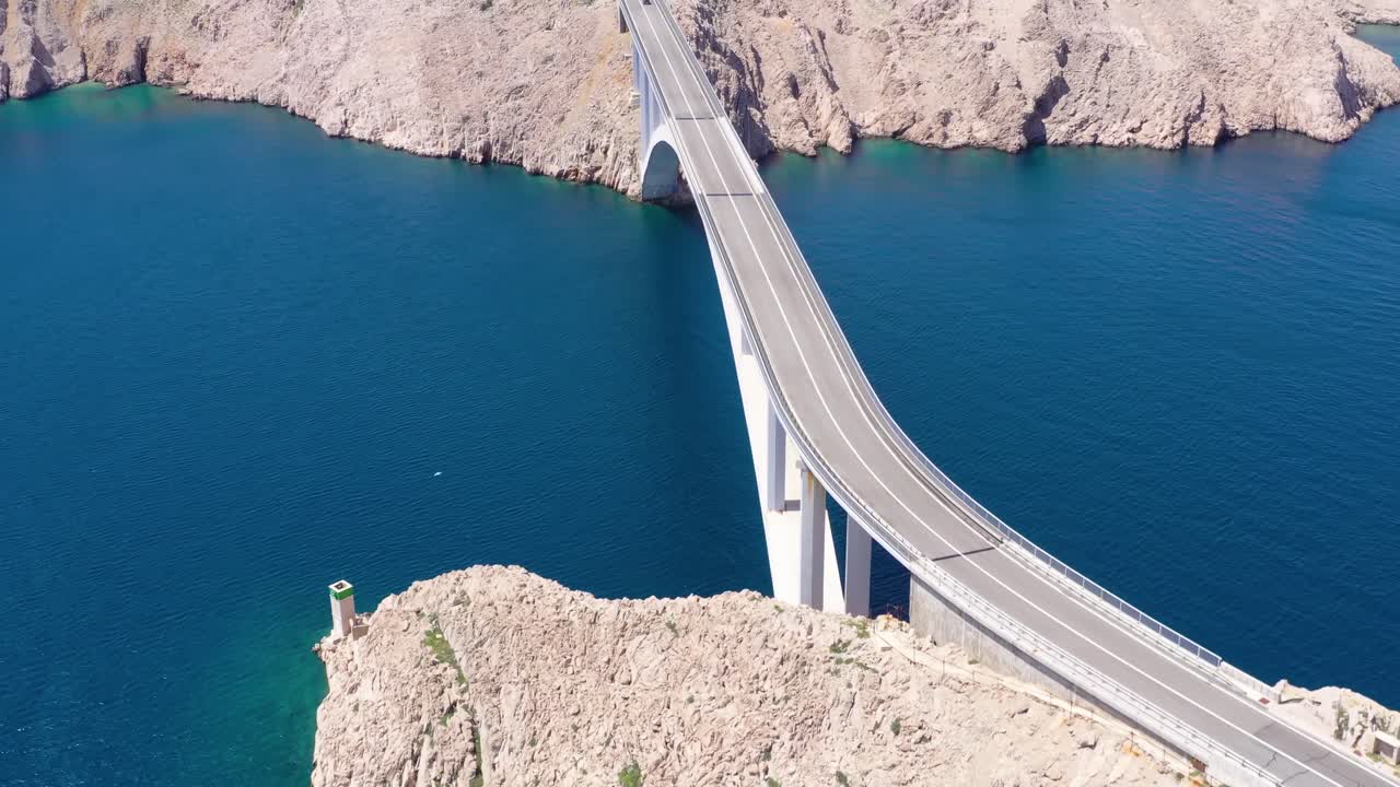 Island of Pag bridge to mainland Croatia. Mediterranean sea. Aerial forward