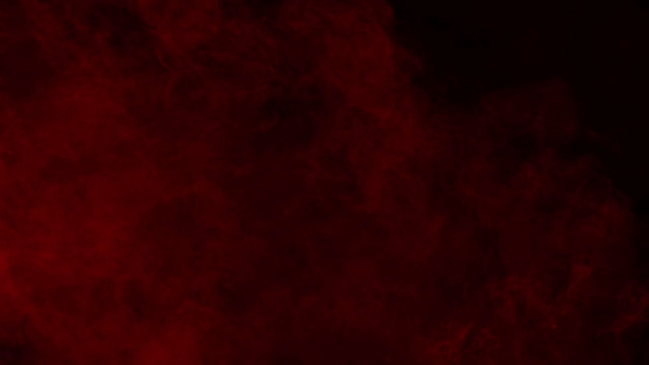Red mist fog or smoke swirls and flows slowly on a black background. Ideal overlay for bloody horror films, dramatic intros, atmosphere of danger or passion