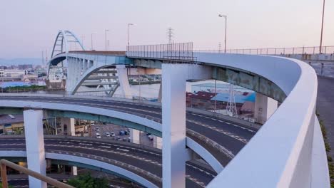 hyperlapse video of shinkizugawa bridge and loop bridge at dusk