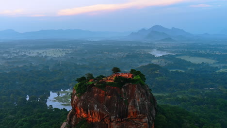 stunning unusually-shaped brown mount with flat top. ruins of ancient sigiriya fortress or lion rock in sri lanka. aerial view.