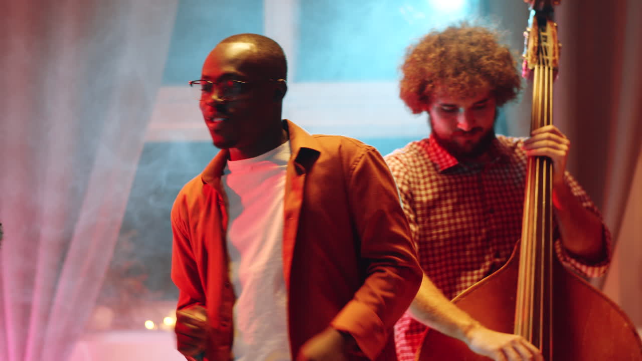 Musicians Playing Instruments and Singing on Live Concert