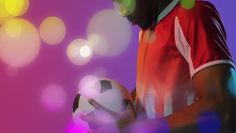Animation-of-african-american-male-soccer-player-over-spots