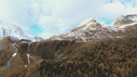 Drone-flight-over-a-stunning-Autumn-alpine-valley