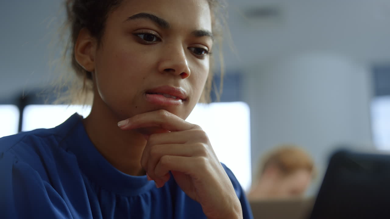 Businesswoman looking at smartphone screen