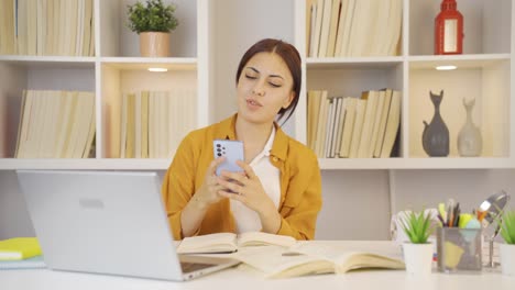 Female-student-using-phone-while-dancing.