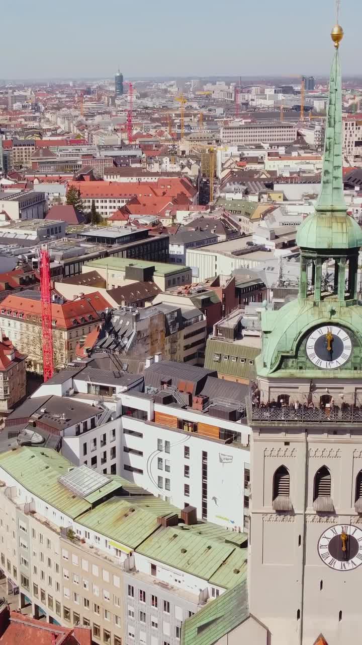 St. Peter Church tower and rooftops of Munich oldtown, aerial vertical view