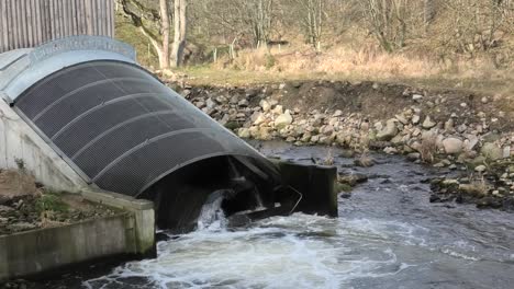 archimedes screw generating electricity on the river don front view