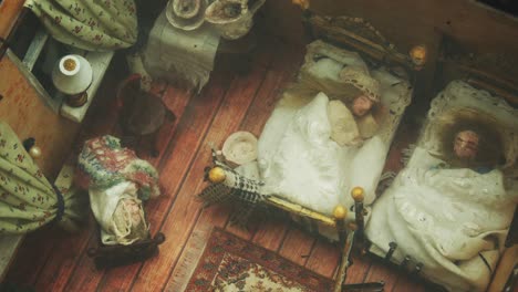 reduced bedroom with sleeping family integrated under glass in the pavement of the pedestrian sidewalk