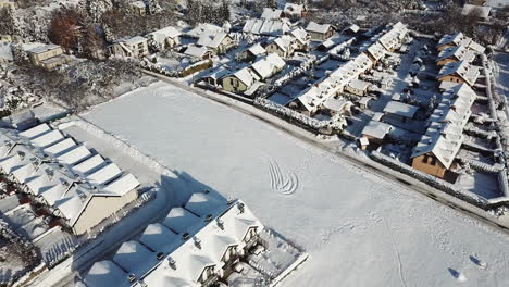 drone flight over city in poland during winter sunny day