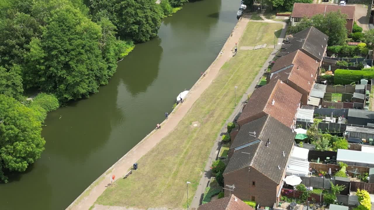 Drone ascends over central Maidstone revealing urban planning and river crossing bridge