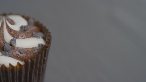 high angle close up shot of a rotating cupcake