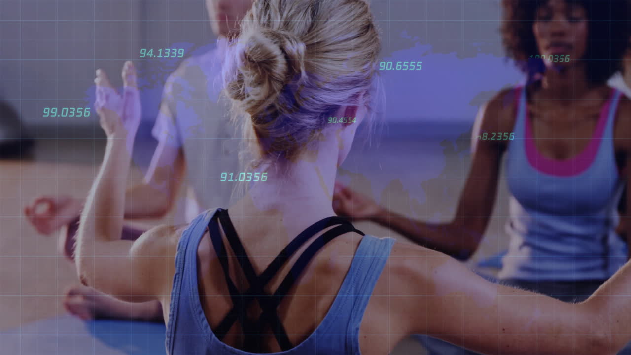 Group practicing seated yoga in wellness studio, with floating grid and numeric data overlay