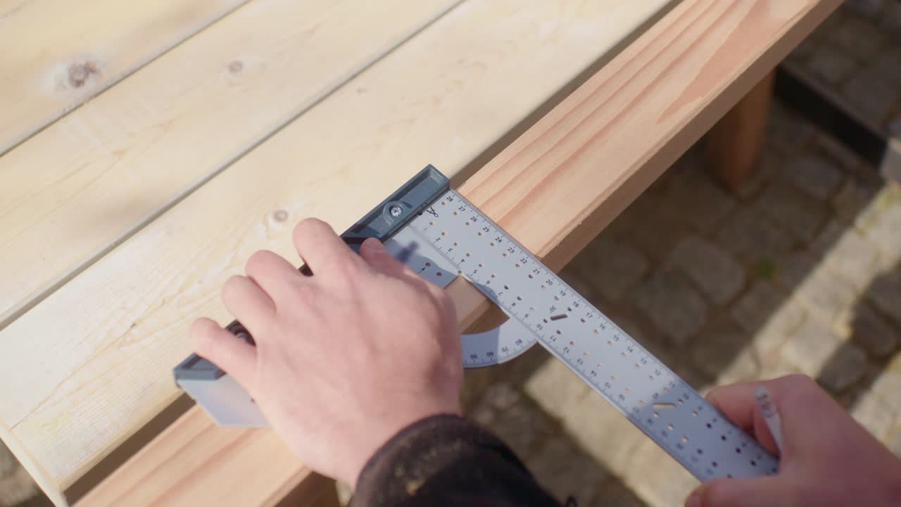 Close up of measuring and marking the wood