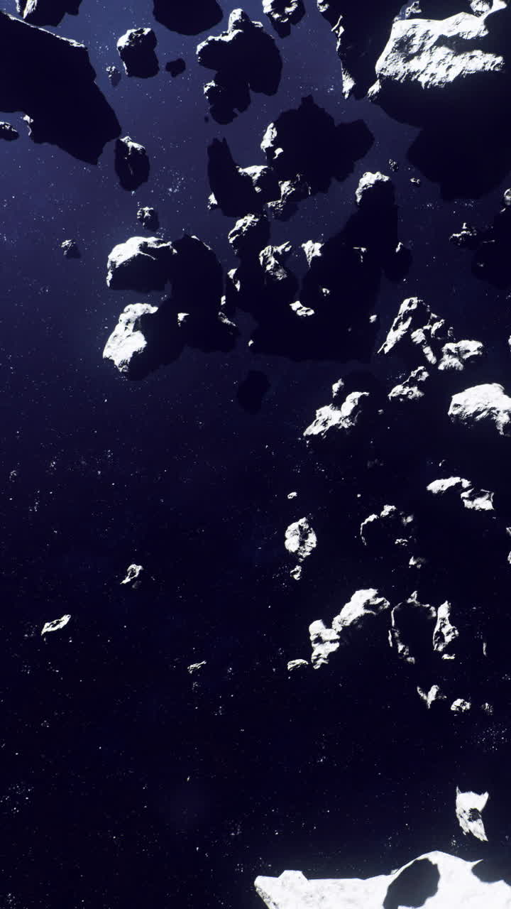 Asteroids floating in space with dark background and stars visible