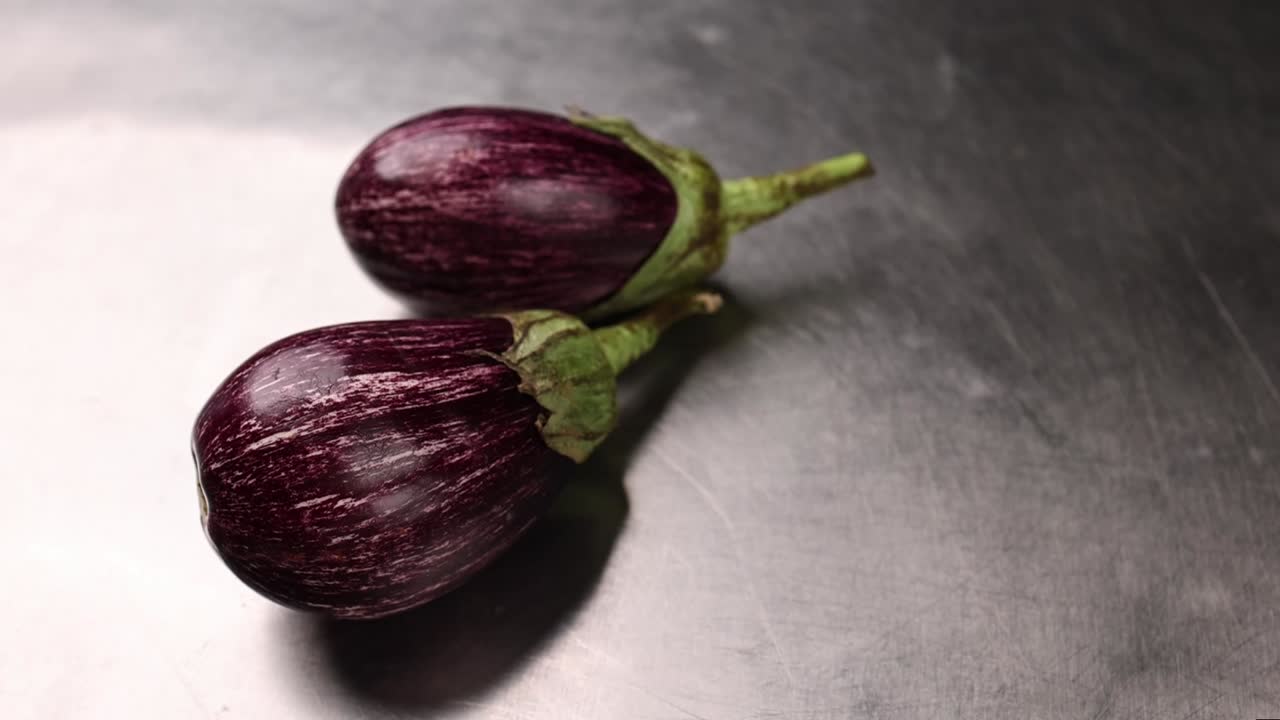 Two Purple Striped Eggplants