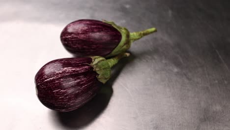 two purple striped eggplants