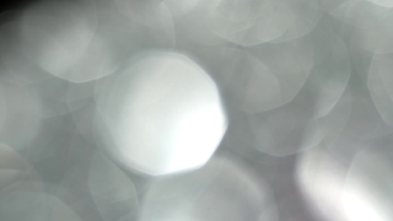 fugas de luz 4k imágenes. lente brillo llamarada bokeh superposiciones, quemar el fondo de la llama. efecto de rayos flash