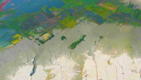 top aerial view of wetlands in bangladesh with paddy fields.