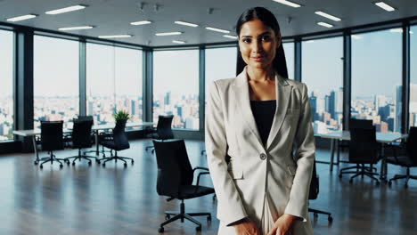 professional businesswoman posing and gesturing in a modern office