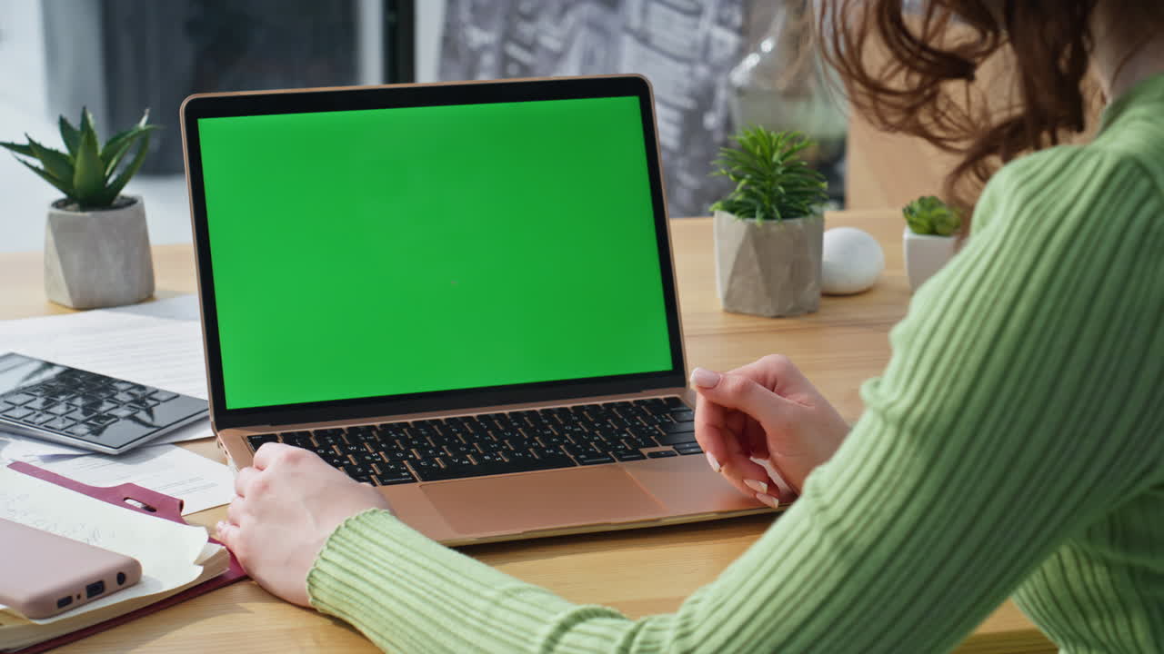 Unknown person talking online conference looking laptop green screen closeup