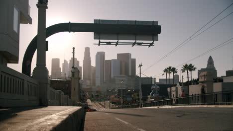 downtown city skyline view from a street at sunrise or sunset