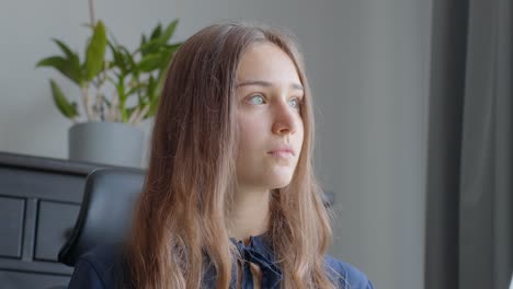 view at pensive woman during work meeting at office