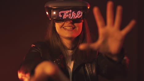 Anonymous-woman-in-VR-goggles-in-neon-light