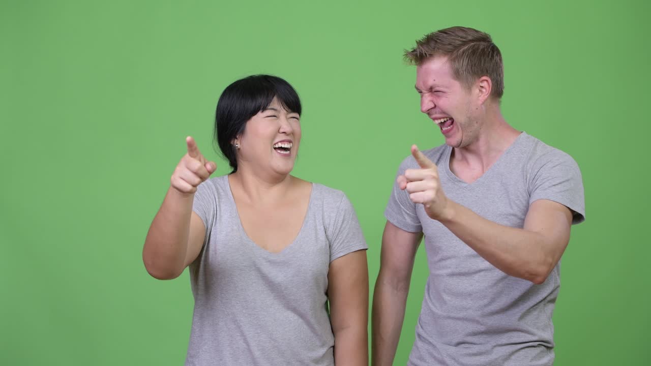 Young multi-ethnic couple laughing together
