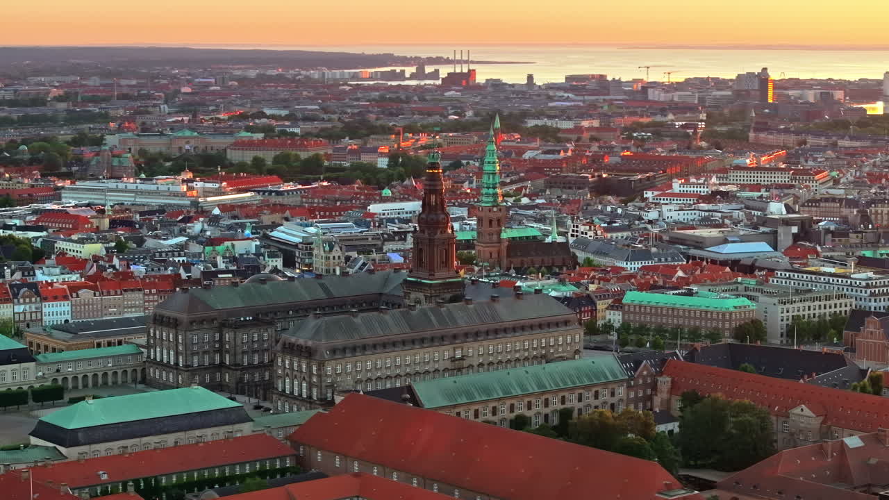 Aerial drone view of the Christiansborg Palace on the islet of Slotsholmen in central Copenhagen, Denmark at sunset