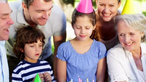 Animation-of-paper-burning-over-happy-family-at-birthday-party