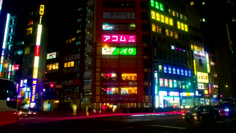 night lapse with many japanese neons at shinjuku south side zoom out