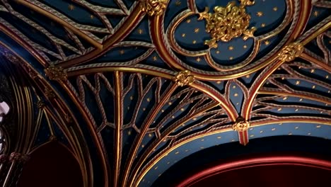 luxurious blue and golden roof with stars located inside of westminster abbey