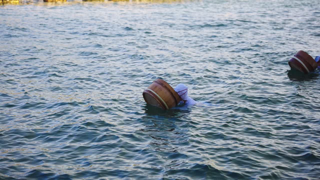 Ama Divers Practice Whistle Breathing Technique Before Diving Underwater