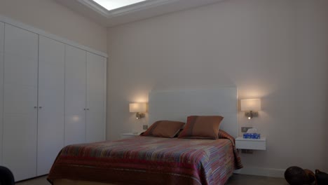 slow establishing shot of a minimal double bedroom within a villa in montpellier