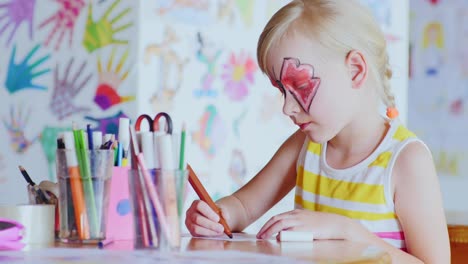 Girl-With-A-Festive-Make-Up-Draws-In-The-Games-Room