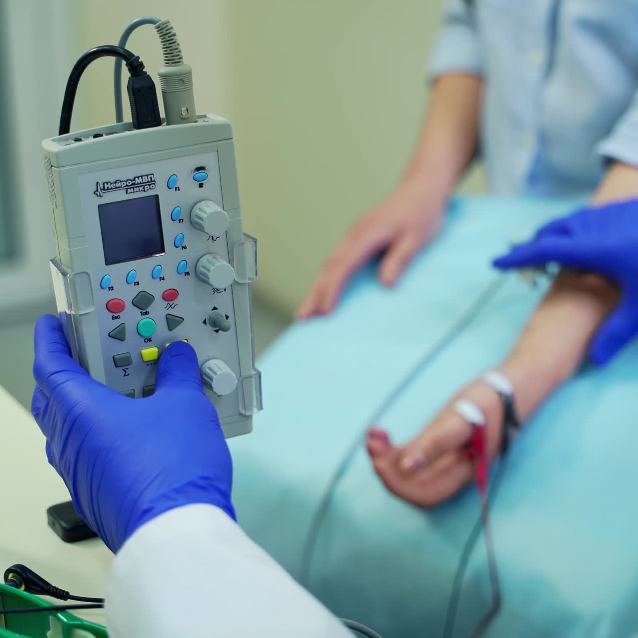 Doctor treating patient in clinic. Male doctor checking health of young woman