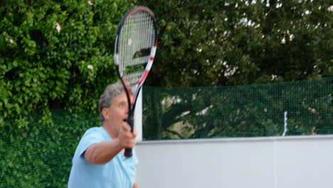 man playing tennis in tennis court 4k