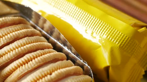 close up of cheese cookies in a yellow packer on table