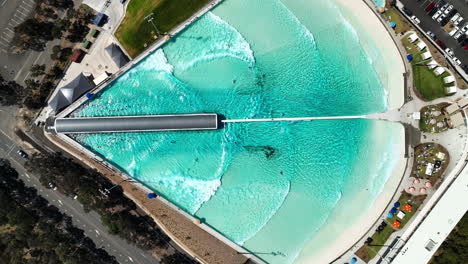aerial view of a wave pool with people surfing