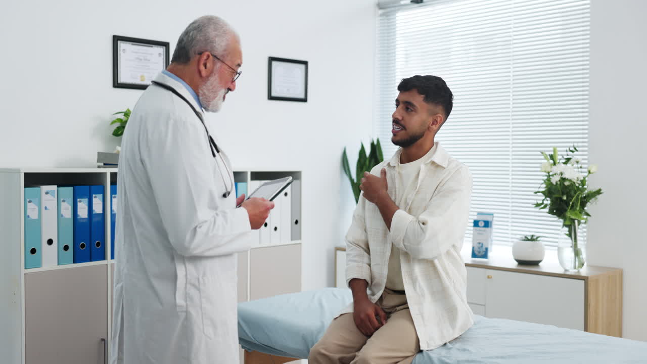 Doctor Consults with Male Patient in Modern Examination Room