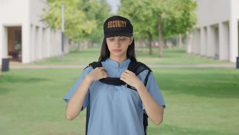 indian female security guard getting ready for duty