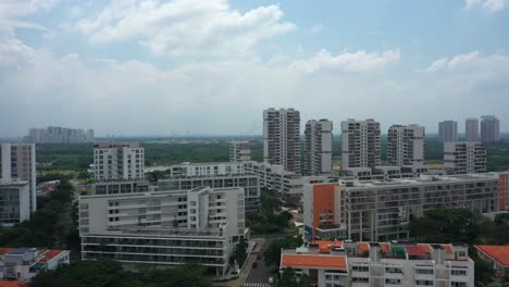 ultra modern city development with residential and commercial high rise buildings, villas, green space and urban sprawl