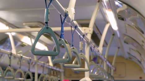 Empty-Handrails-Of-A-Suburban-Train,-CLOSE-UP