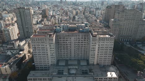 aerial pan right of clinic hospital and famous public faculty of medicine near houssay square, buenos aires