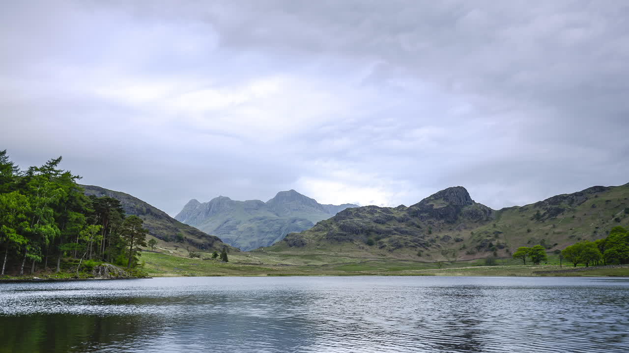 Lake District National park landscape timelapse. 4k time lapse at Blea Tarn Lake in Cumbria, England with clouds moving on an overcast day