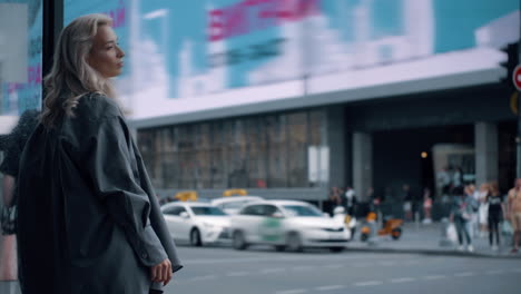 Female-model-posing-city-in-casual-wear-at-urban-background-near-car-road.