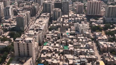 aerial flying over densely packed buildings in karachi
